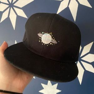 Saturn graphic black trucker snap back hat